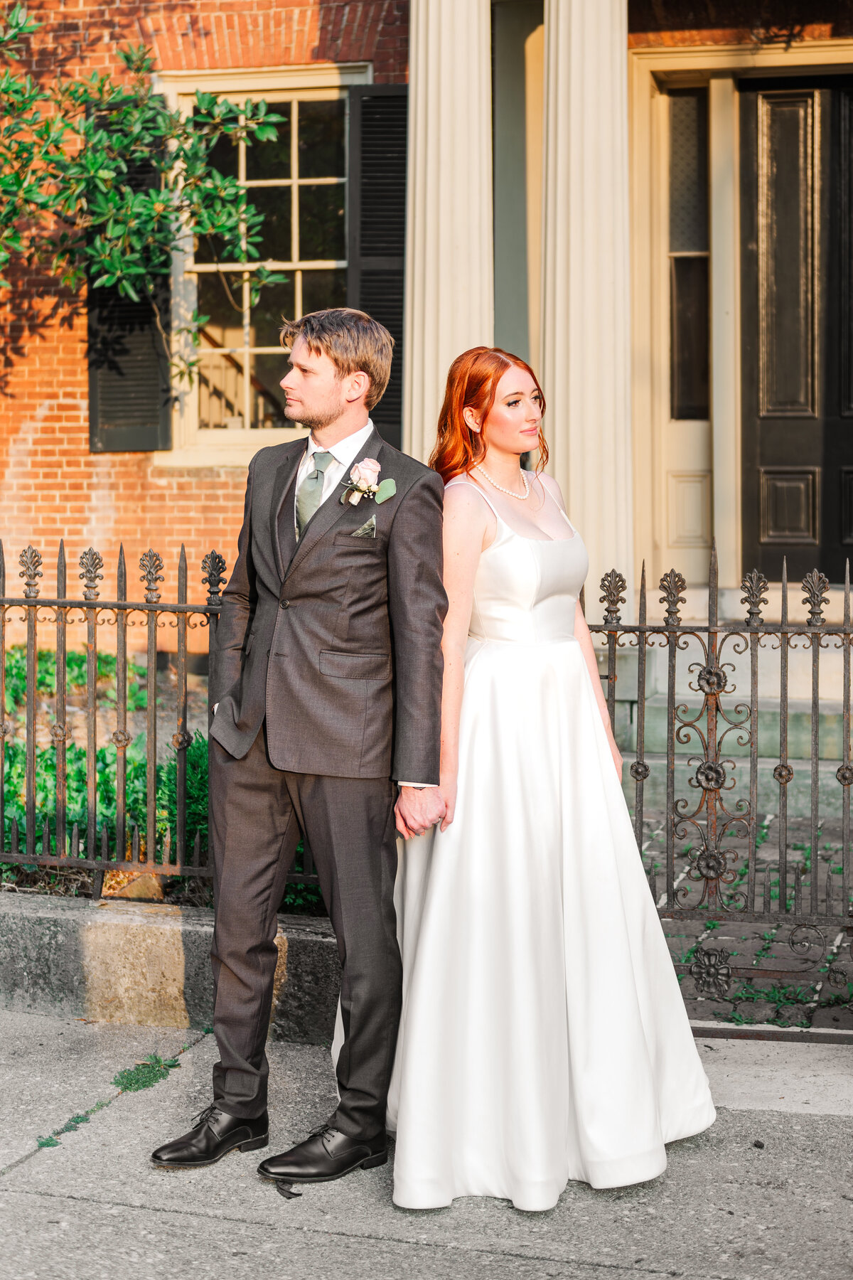 bride and groom in serious pose during golden hour