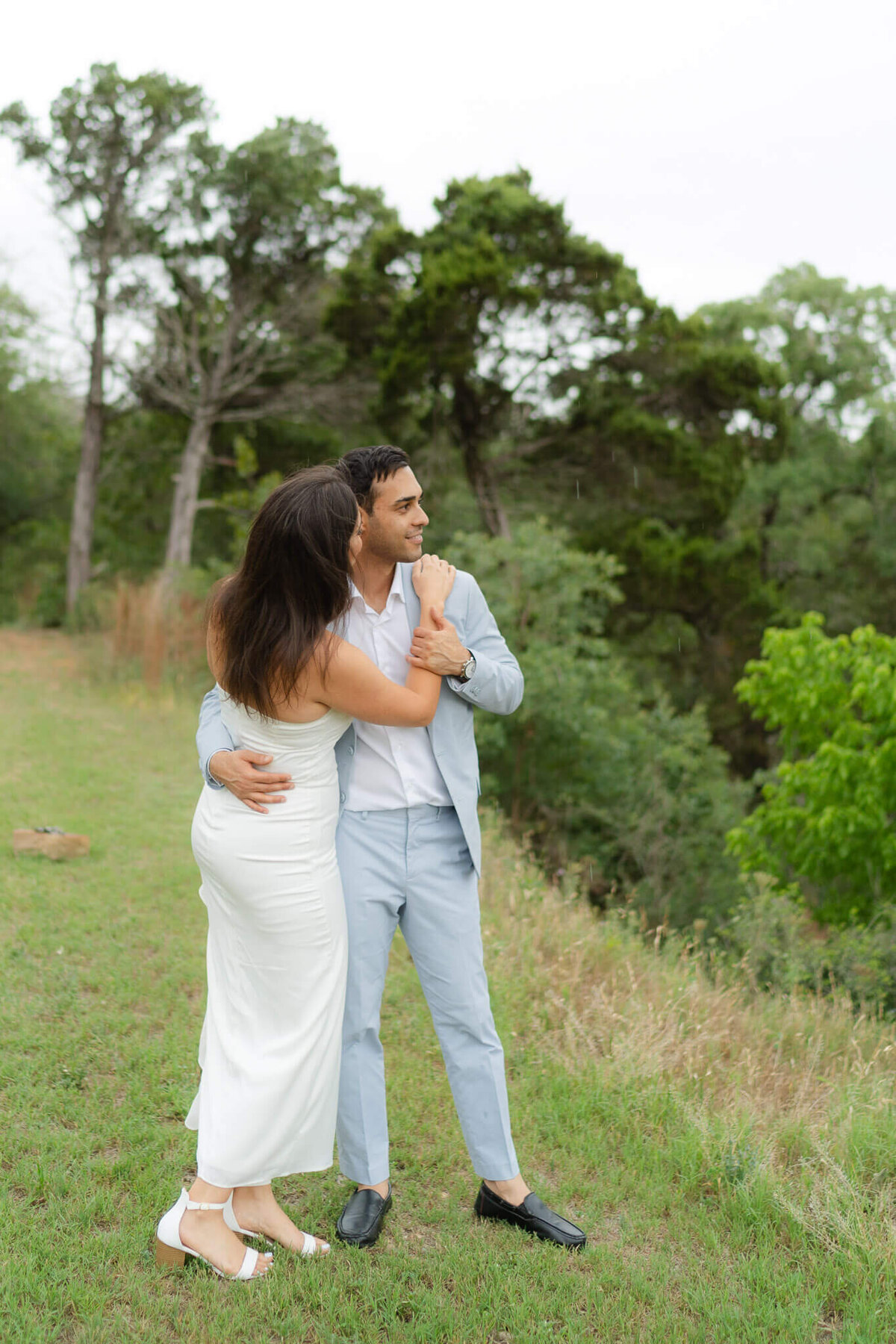 a couple looks over an overlook during their couple's session