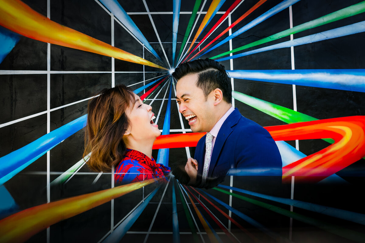 Vibrant colors are highlighted behind a newly engaged asian couple in Venice Beach California, photographed by Tanya Parada