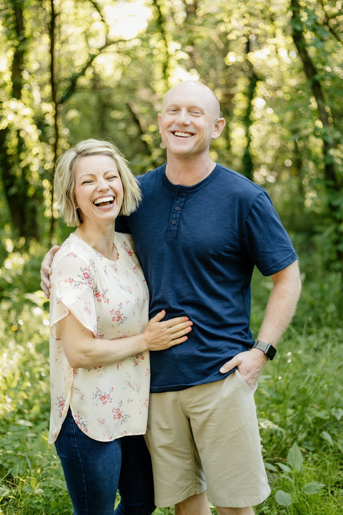 Husband and wife smile together for family portraits