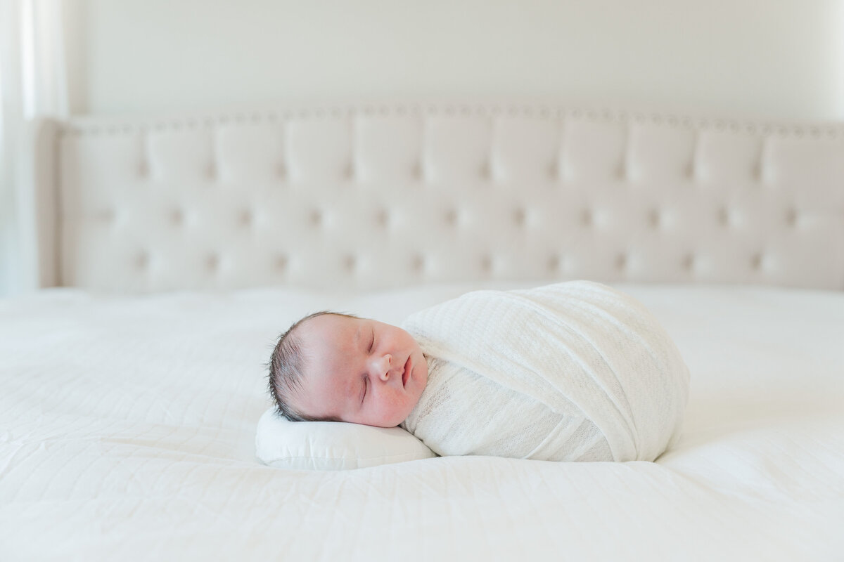 Light and neutral baby boy in home lifestyle newborn photos colorado elena spraguer photography 0005