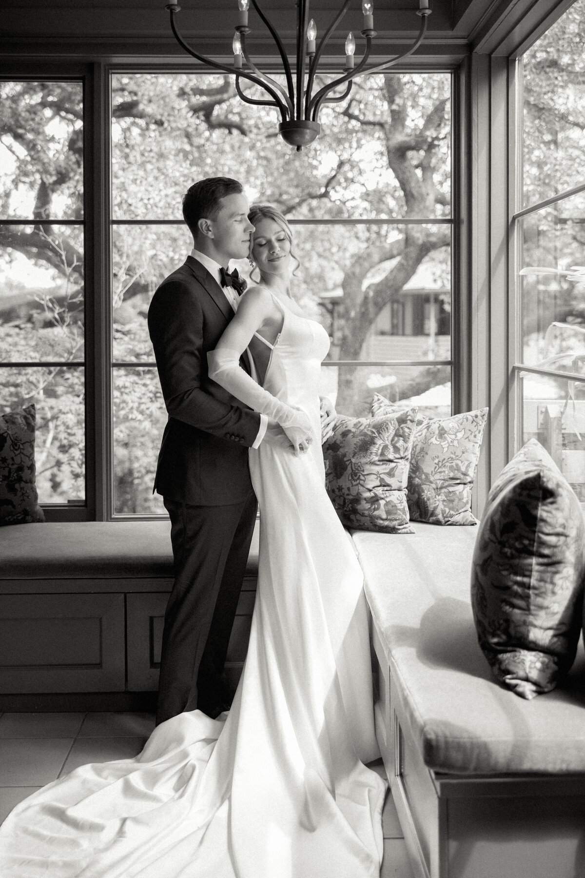 bride and groom embracing at wedding in Austin