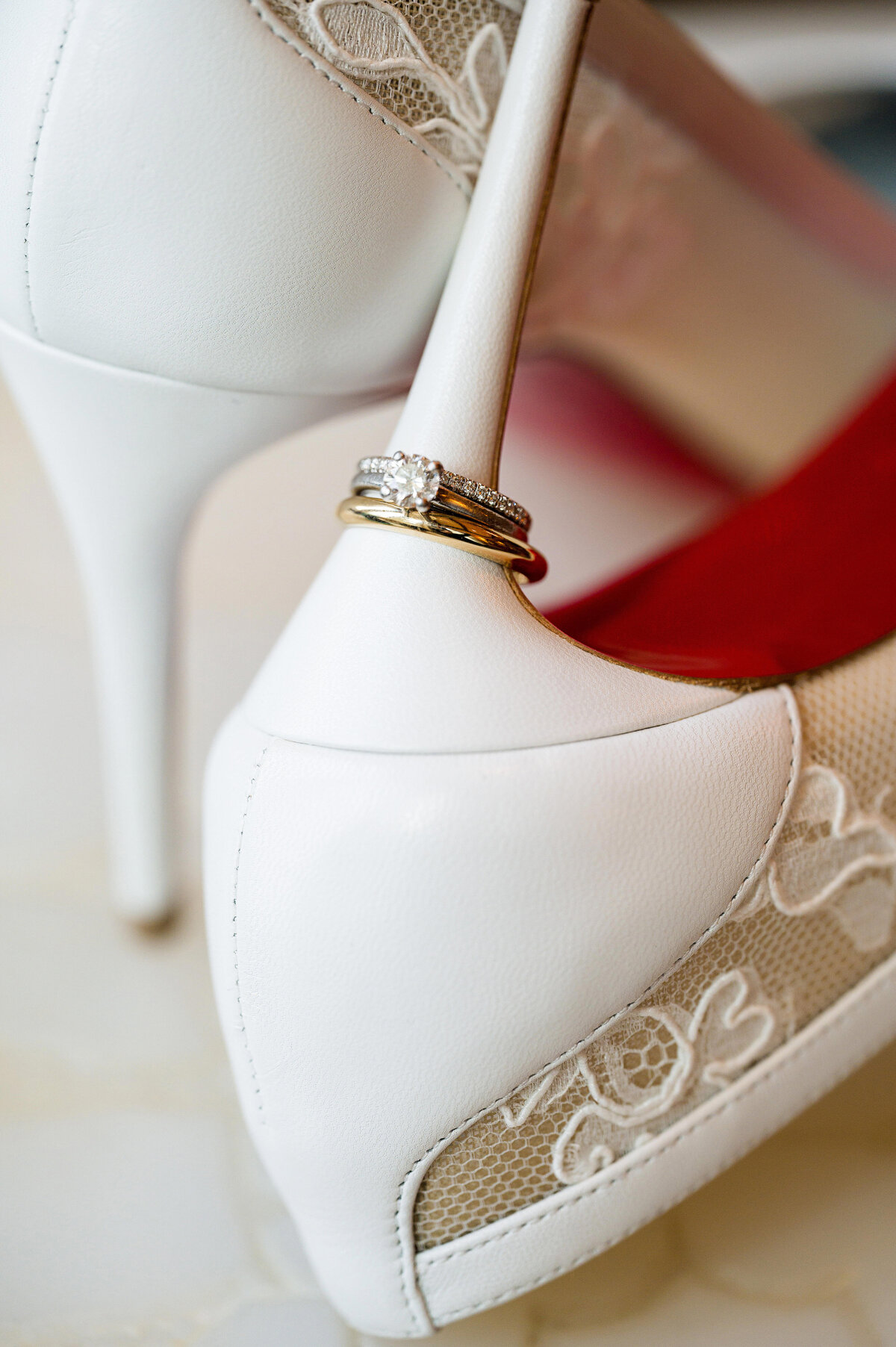 wedding shoes with ring and red soles