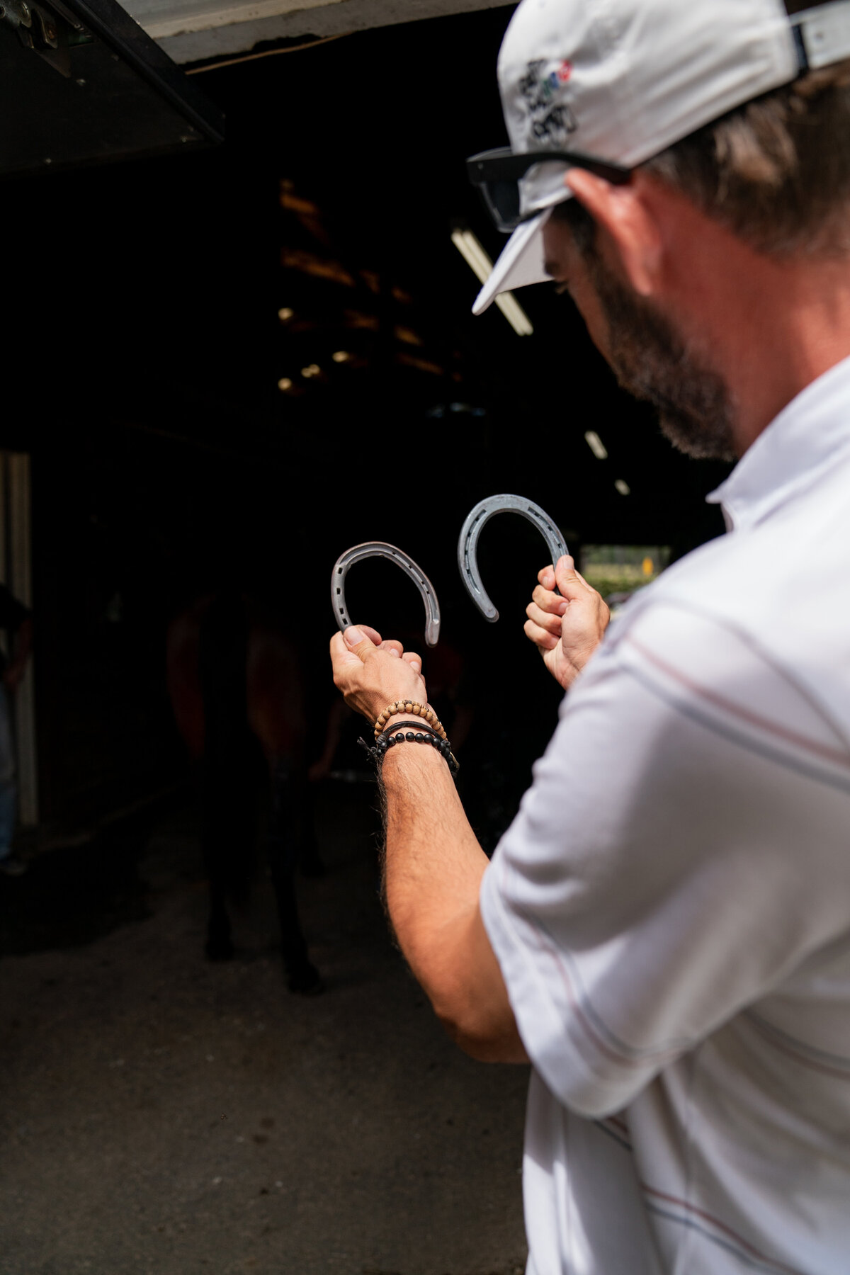 Horseshoes being compared by Golf In Your State Matt Cardis in stable at Pinehurst Race Track in May 2020. 