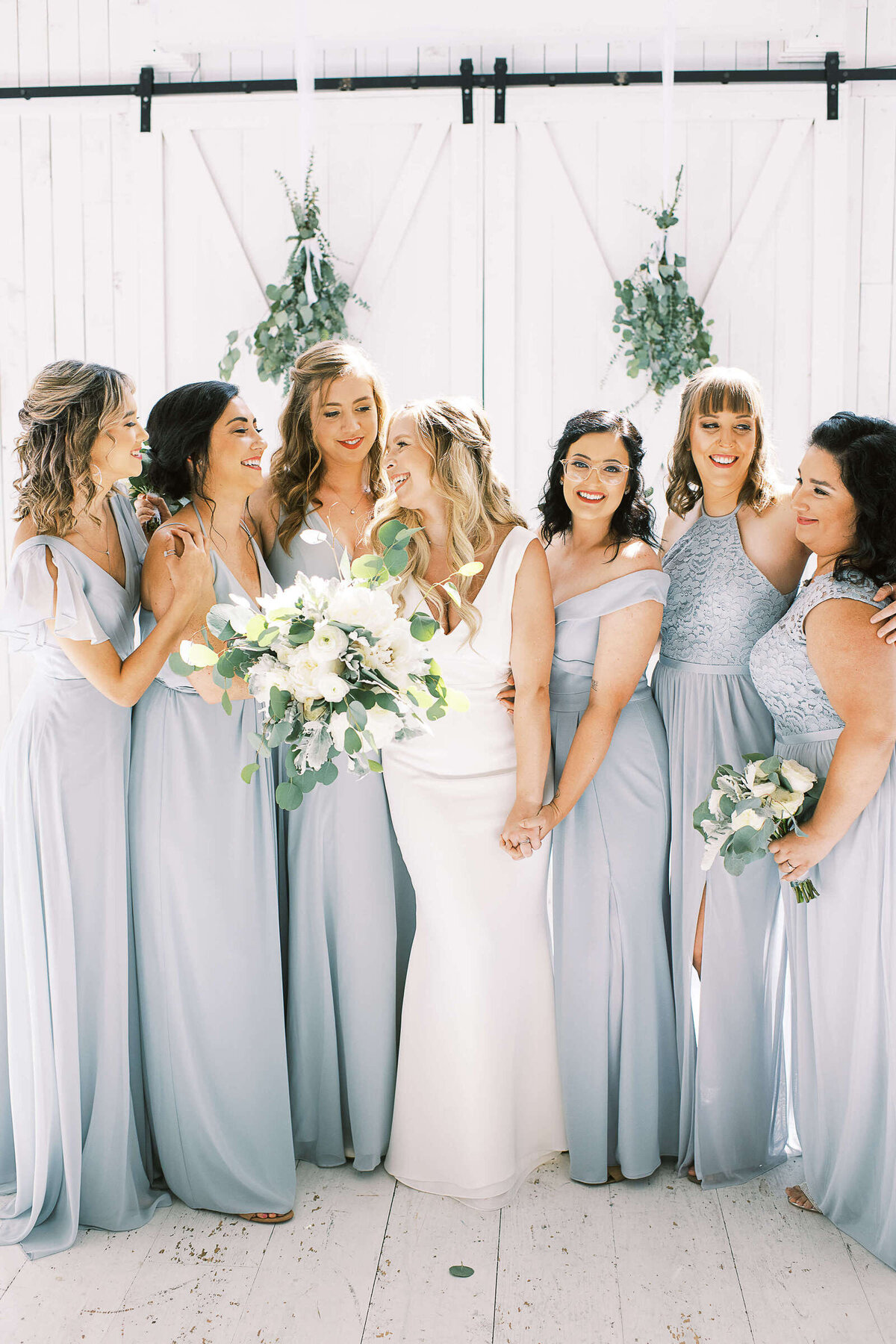 Wedding party in light blue dresses at The White Sparrow in North Texas