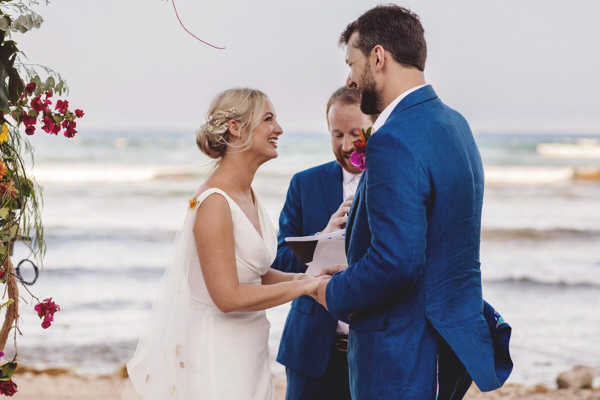 Bride laughing with groom at Blue Venado Seaside Riviera Maya wedding