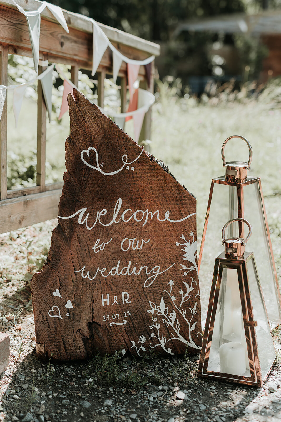 Rustic wooden welcome sign for a woodland wedding at  Two Woods Estate