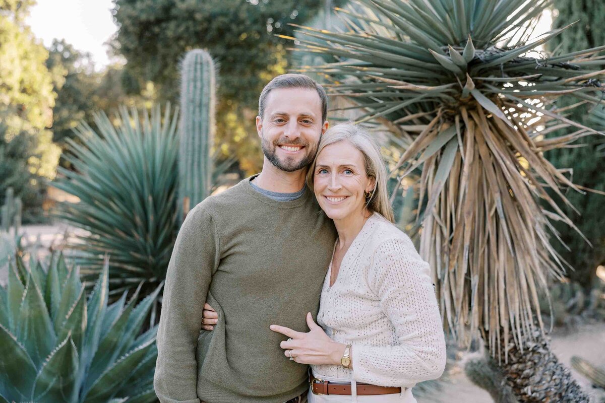 couple smiling at camera at arizona cactus garden