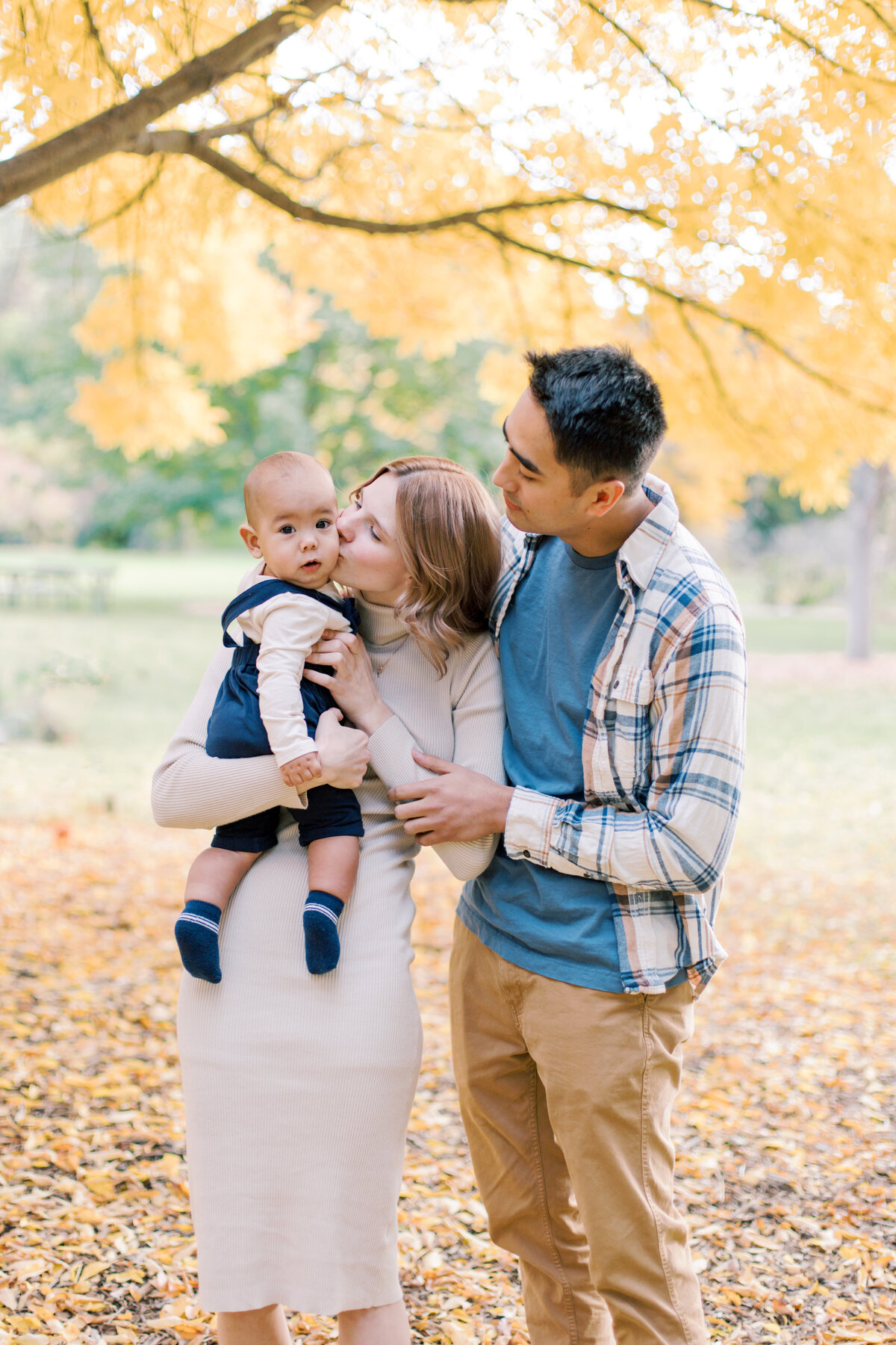 family in fall foliage at finch arboretum taken by one of the photographers in spokane wa
