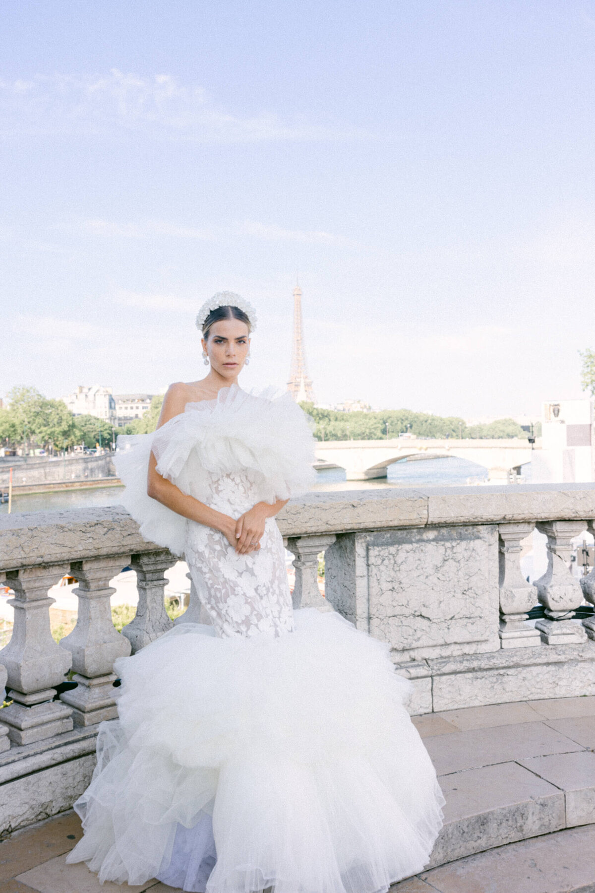 A wedding photo of a bride in her white dress in the streets of Paris in France.