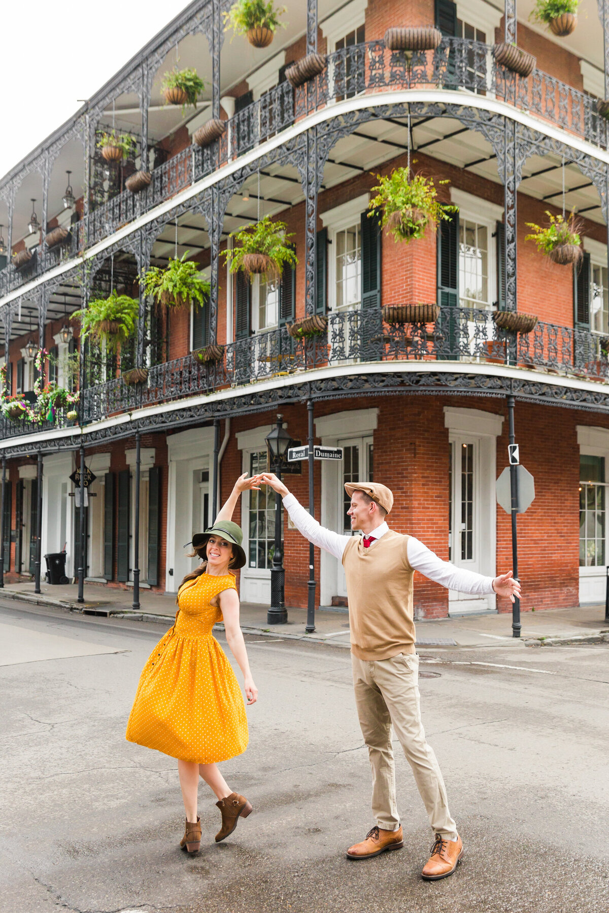 man twirling woman in couple photo in New Orleans
