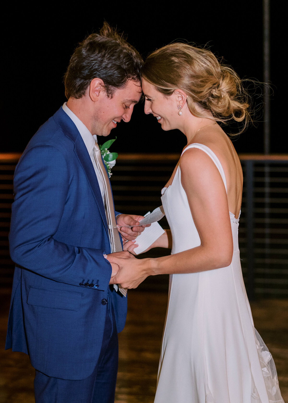 Newly married couple shares a private moment on the dance floor after their reception, image captured by Virginia wedding photographer Erin Winter