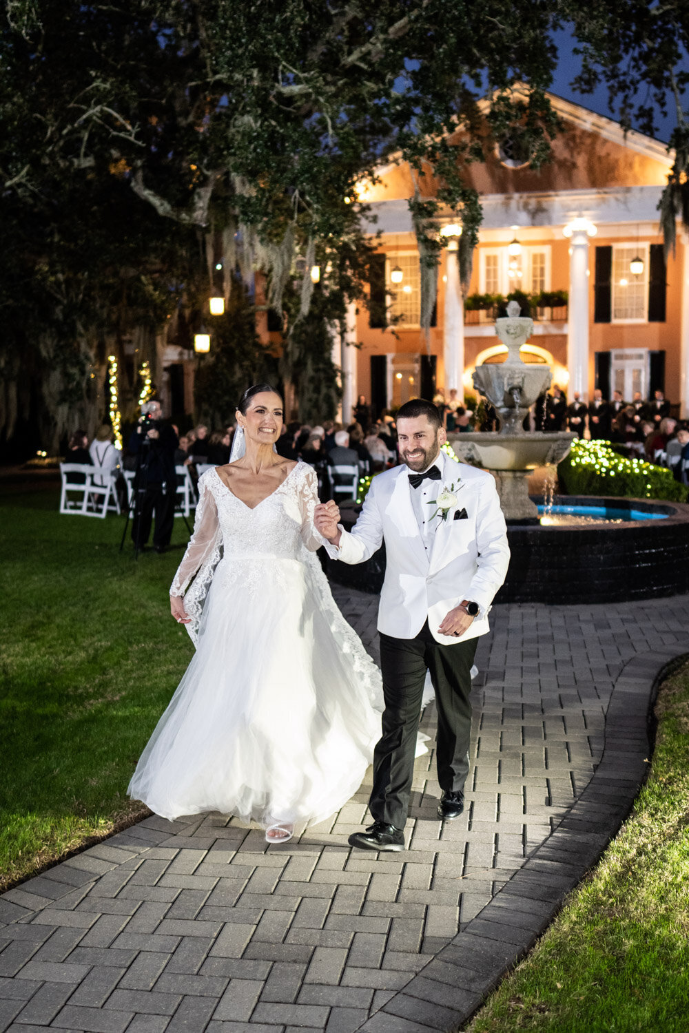 Bride and groom walk down the aisle at Southern Oaks