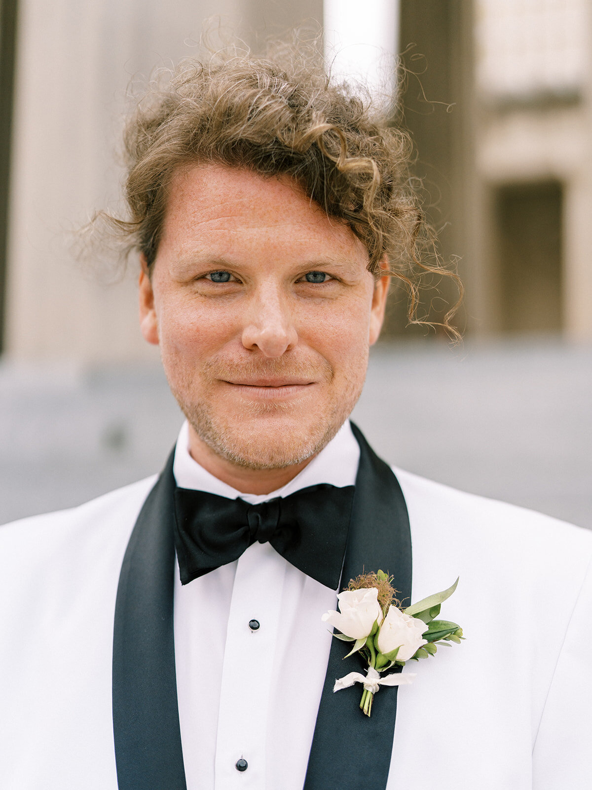 This romantic summer solstice wedding held at the elegant War Memorial was filled with pops of cherry red, pink and white flowers and lush greenery. Floral Design by Rosemary and Finch in Nashville, TN.