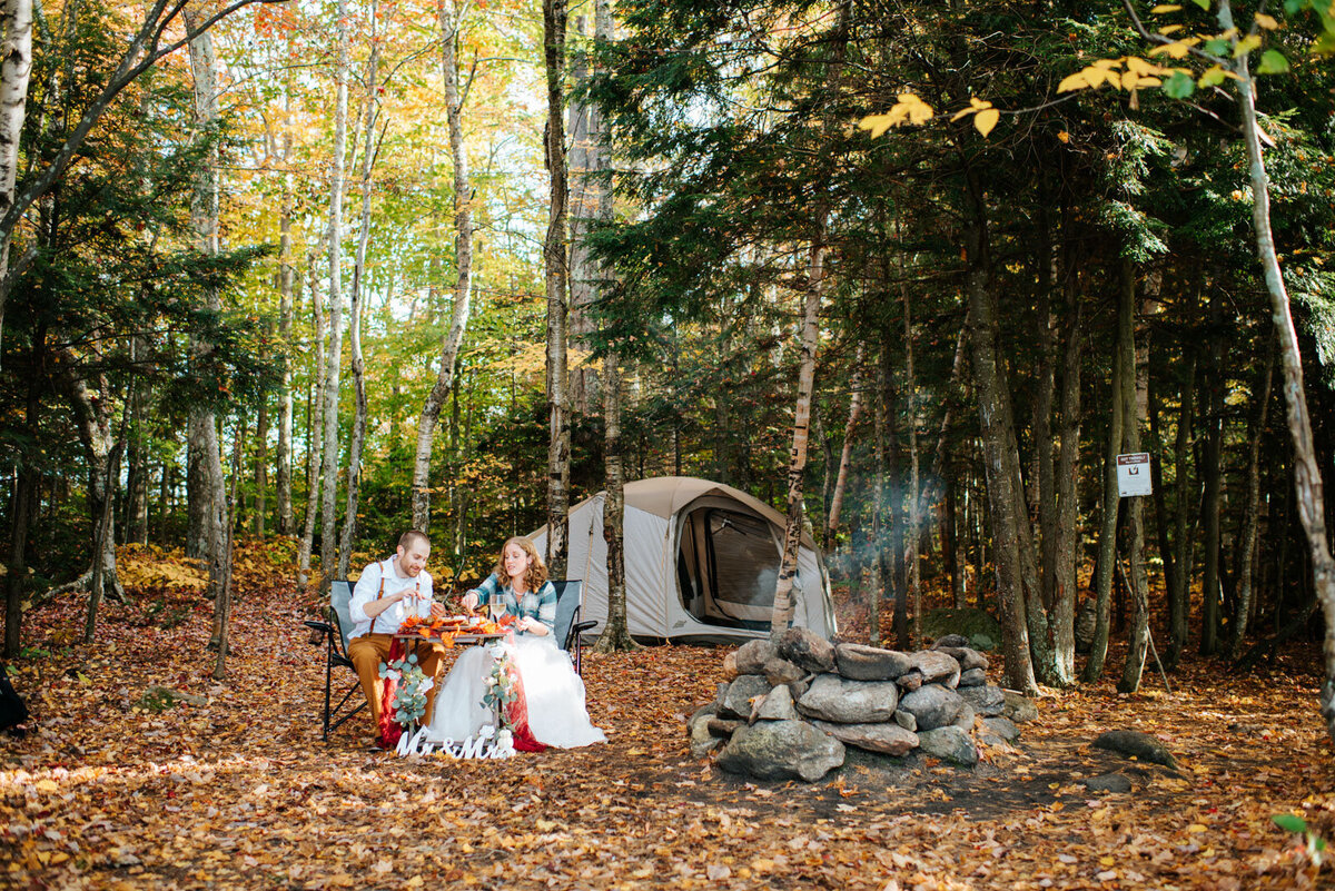 chittenden vermont reservoir camping elopement couple in front of tent with camp fire