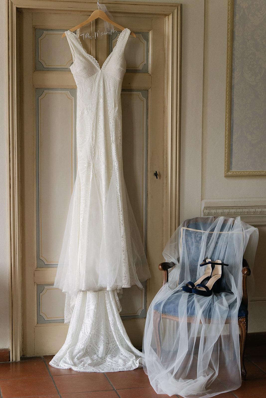 An elegant wedding gown and bridal shoes at the bridal suite