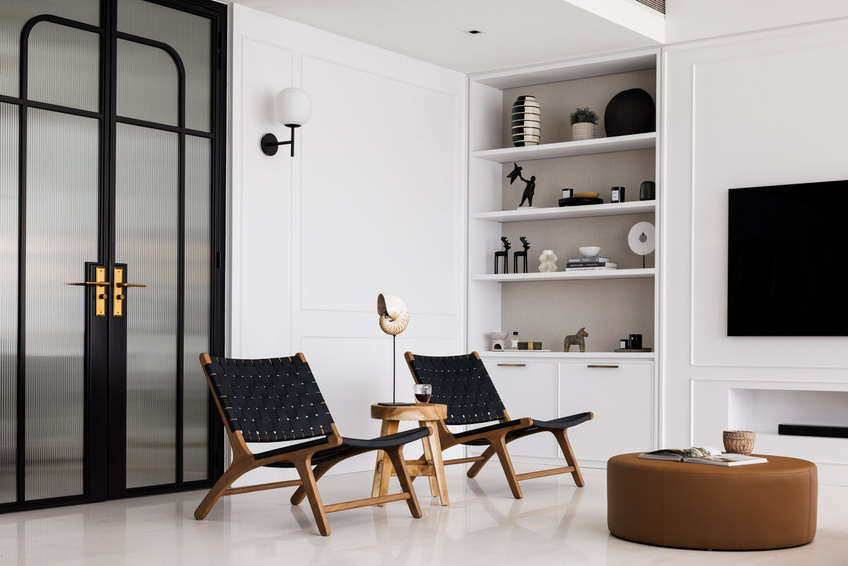 White living room with blue chairs