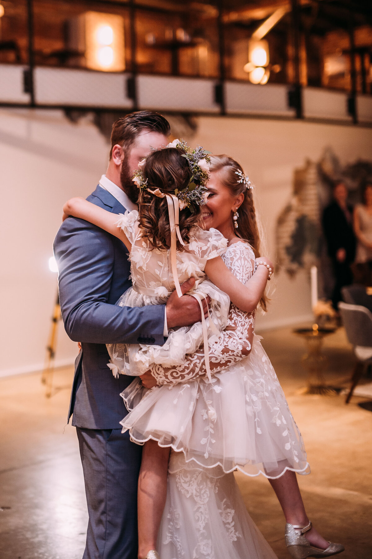 bride and groom dancing at wedding reception blended family