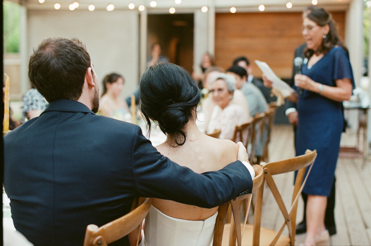 Speeches being heard by bride at groom at Mattie's wedding, Austin