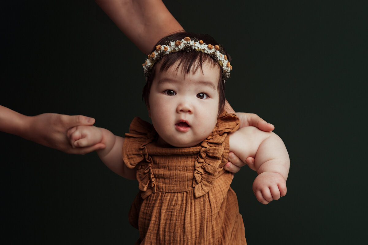 toddler-walking-with-moms-hands