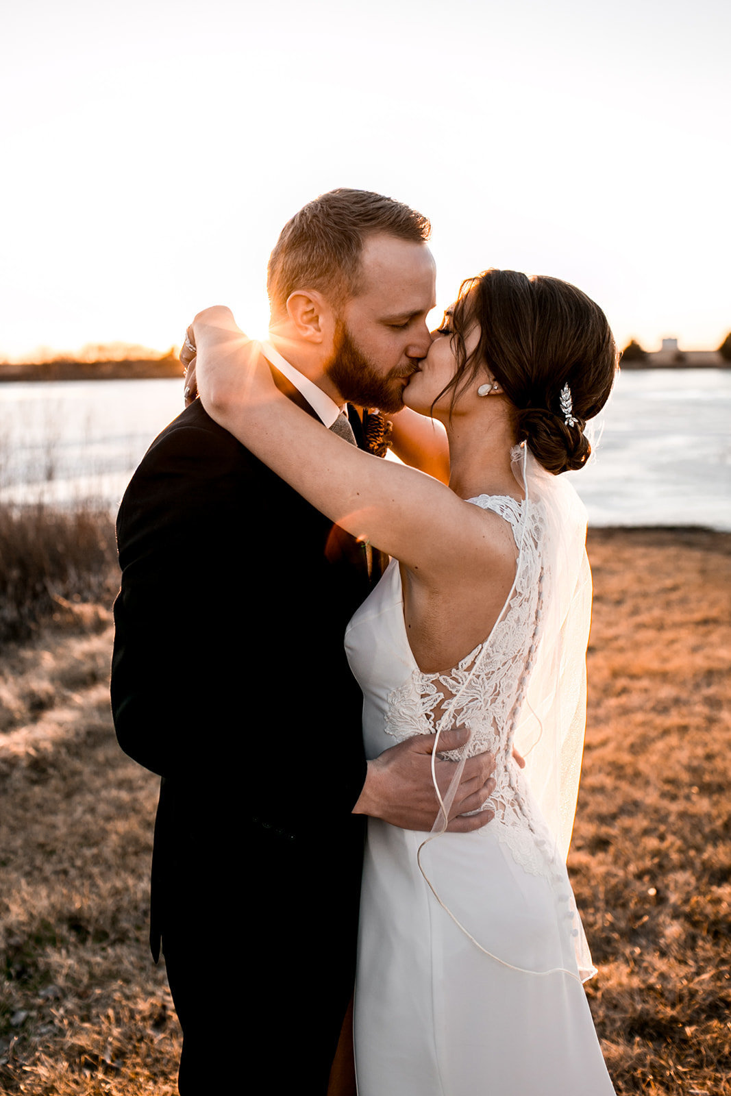 Des Moines Iowa Wedding couple kissing at sunset.