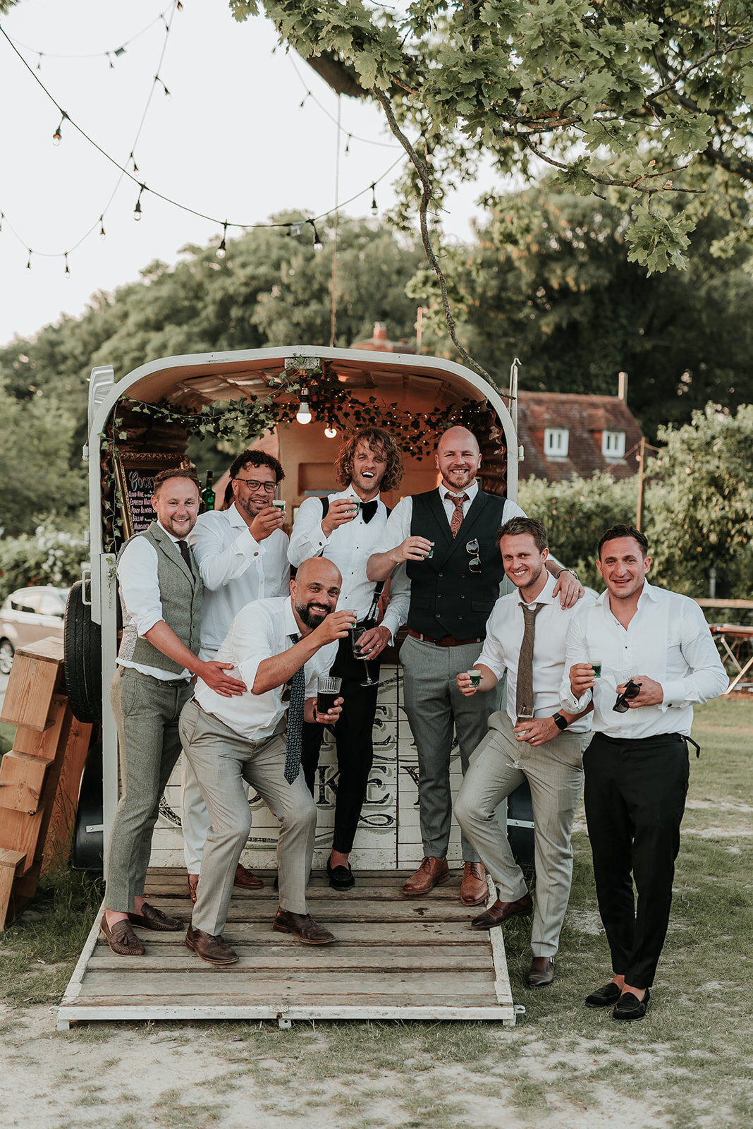 Groom and his groomsmen celebrate with drinks at Oak Tree Barn Tonbridge
