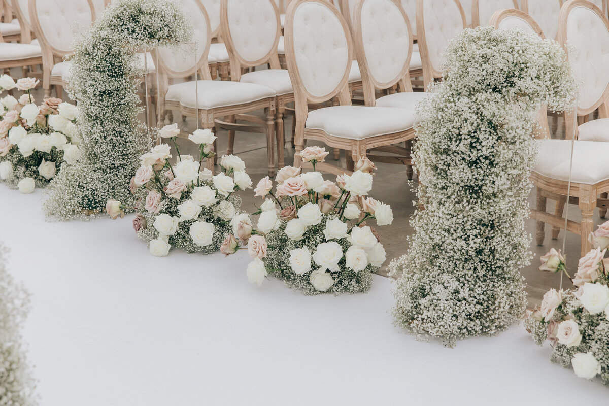 Romantic rose themed wedding aisle