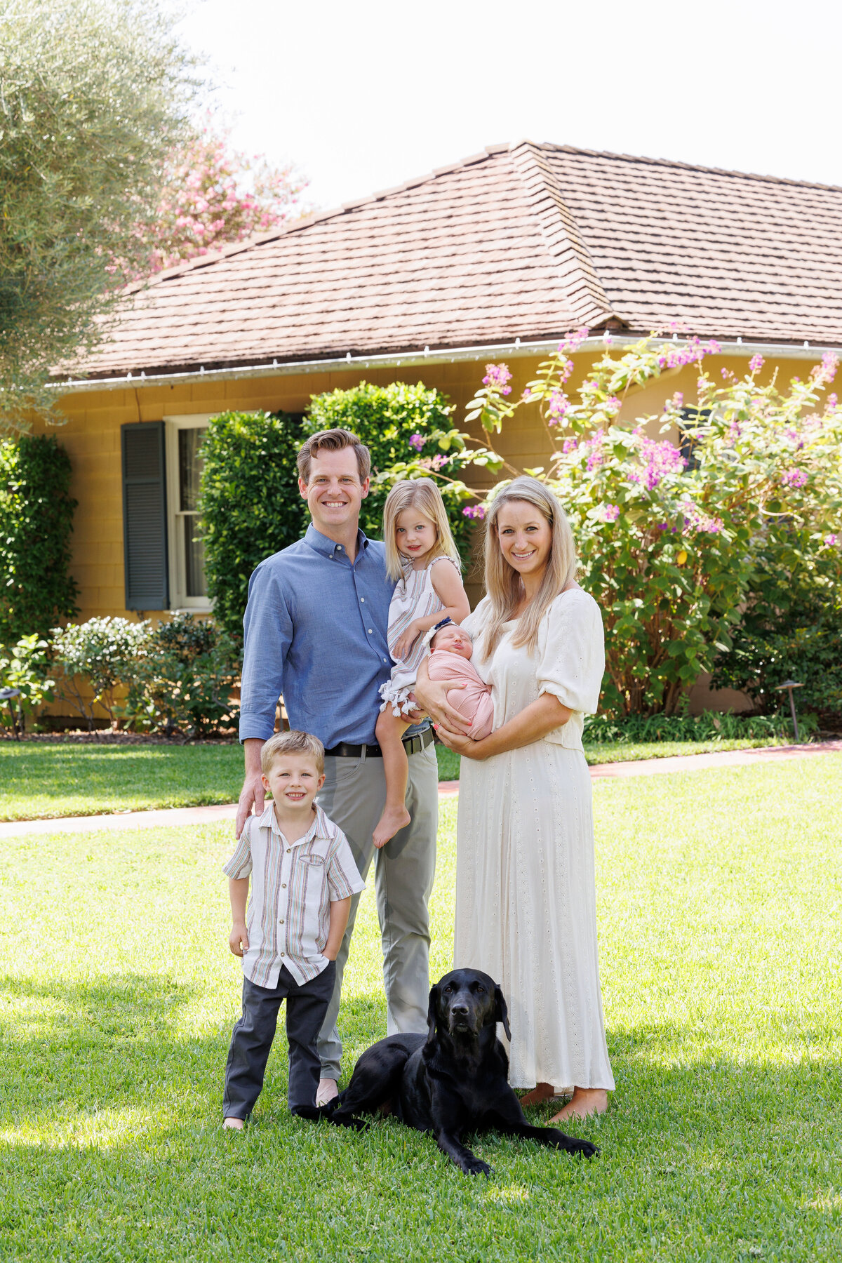 Young family wearing soft tones