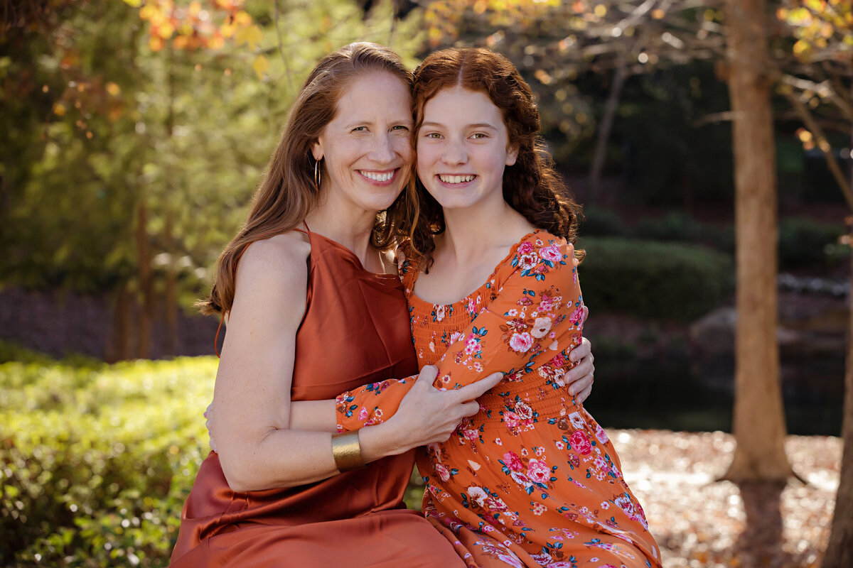 Elegant and beautiful mother‑daughter photo in fall park setting at Ballantyne Corporate Park Charlotte NC