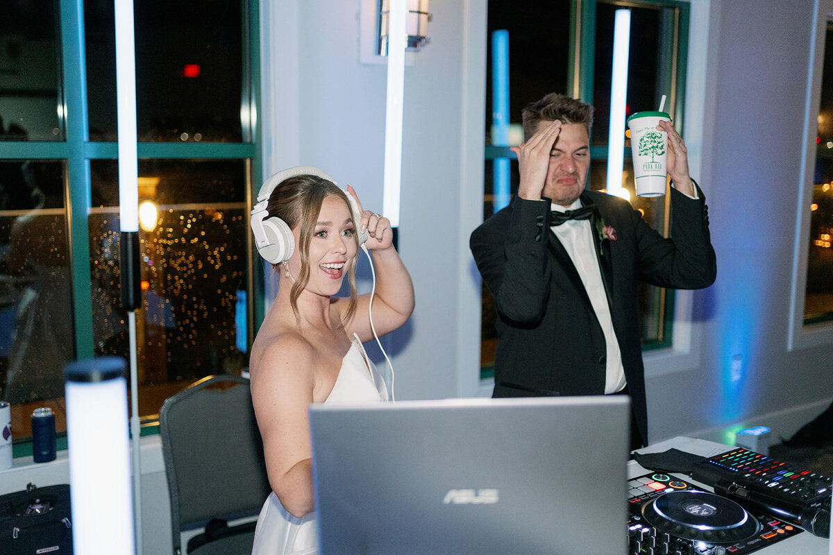 Candid wedding reception dancing at Boatwerks in Holland Michigan with modern documentary-style wedding photography.