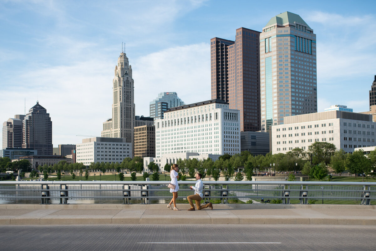 Man proposes to his girlfriend in front of the downtown Columbus skyline