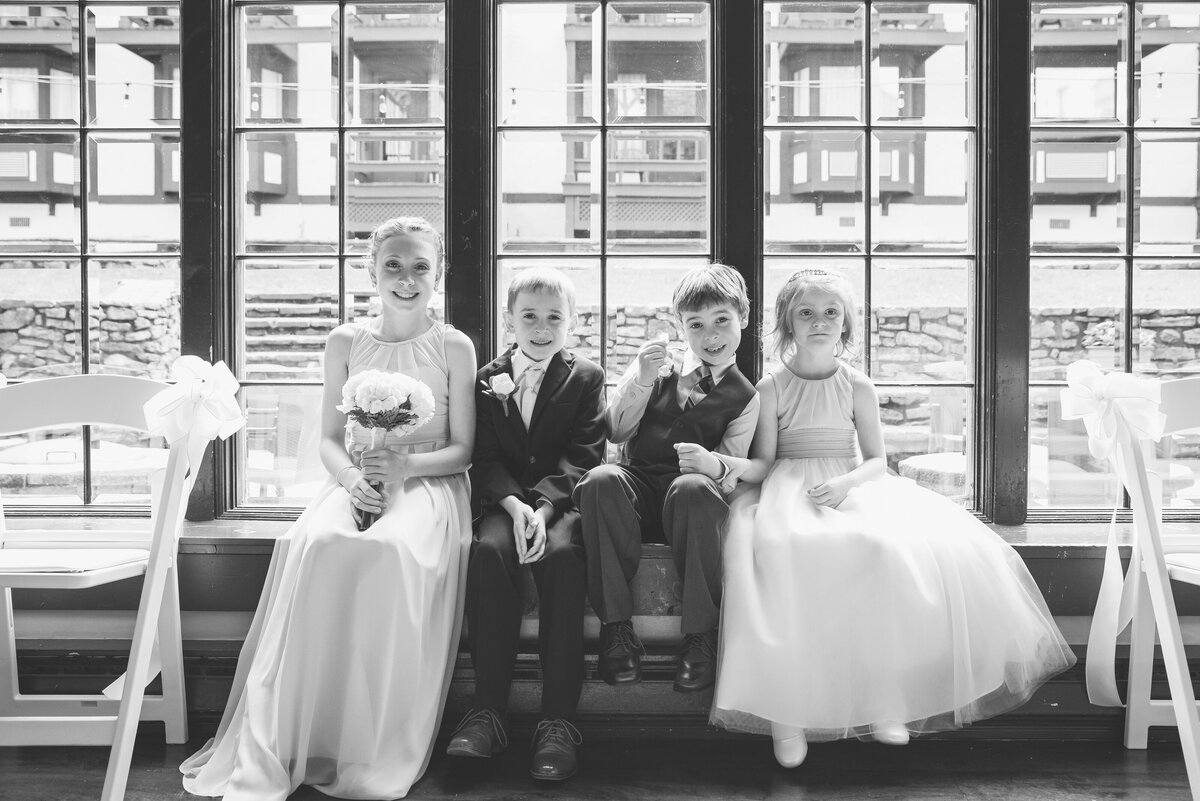 Kids in wedding bridal party posing for a photo.