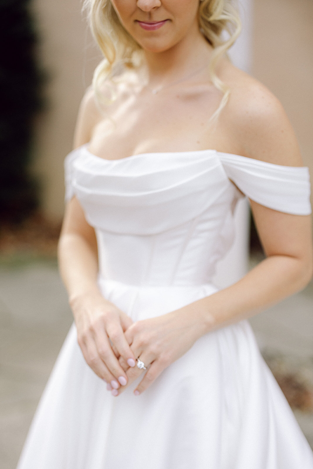 close up of a bride with her rings on by a Philadelphia photographer.
