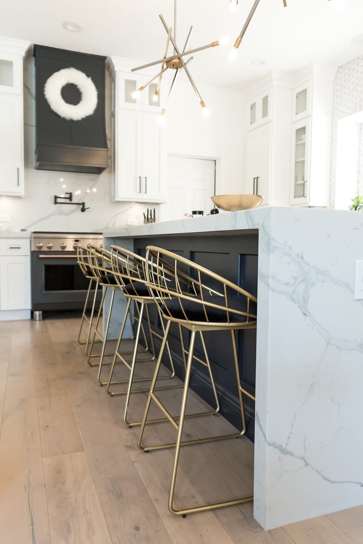 dewine design orlando interior designer modern lakehouse kitchen with gold barstools