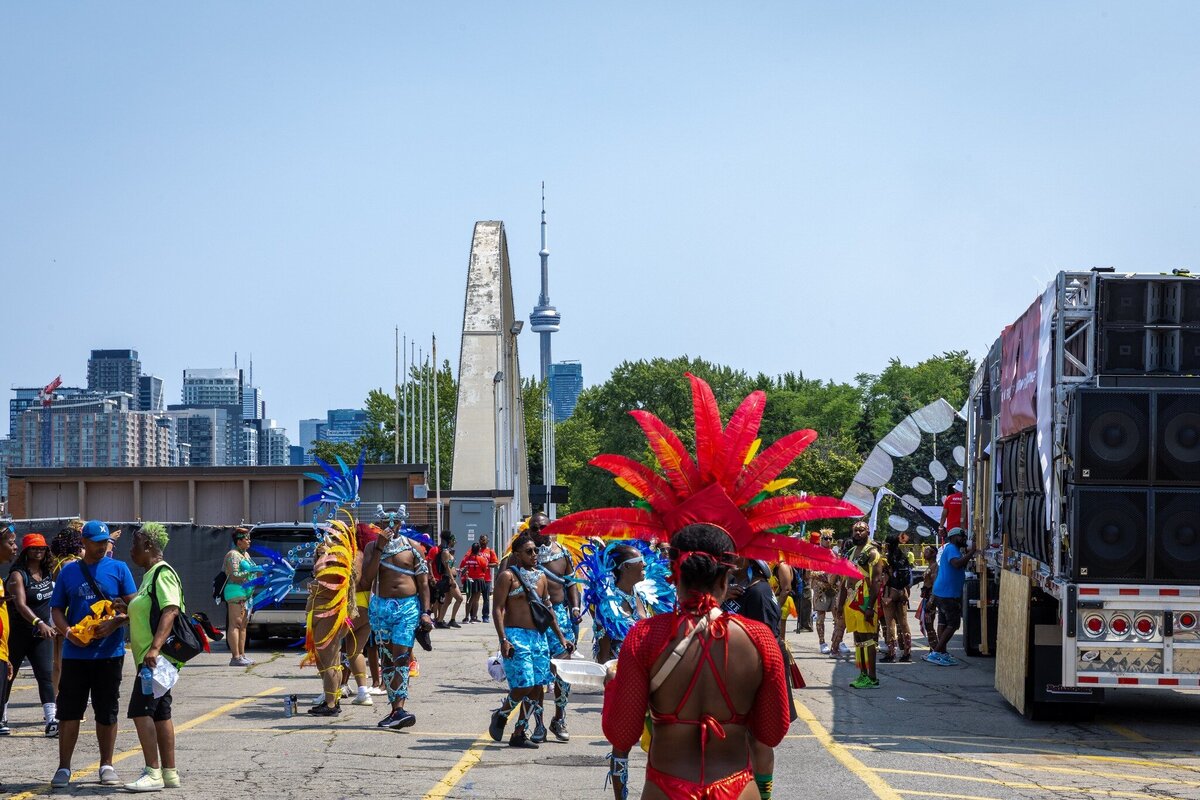 Toronto caribbean carnival parade masquerader in costume with Sunlime Mas, the number 1 medium size band at Toronto Carnival.