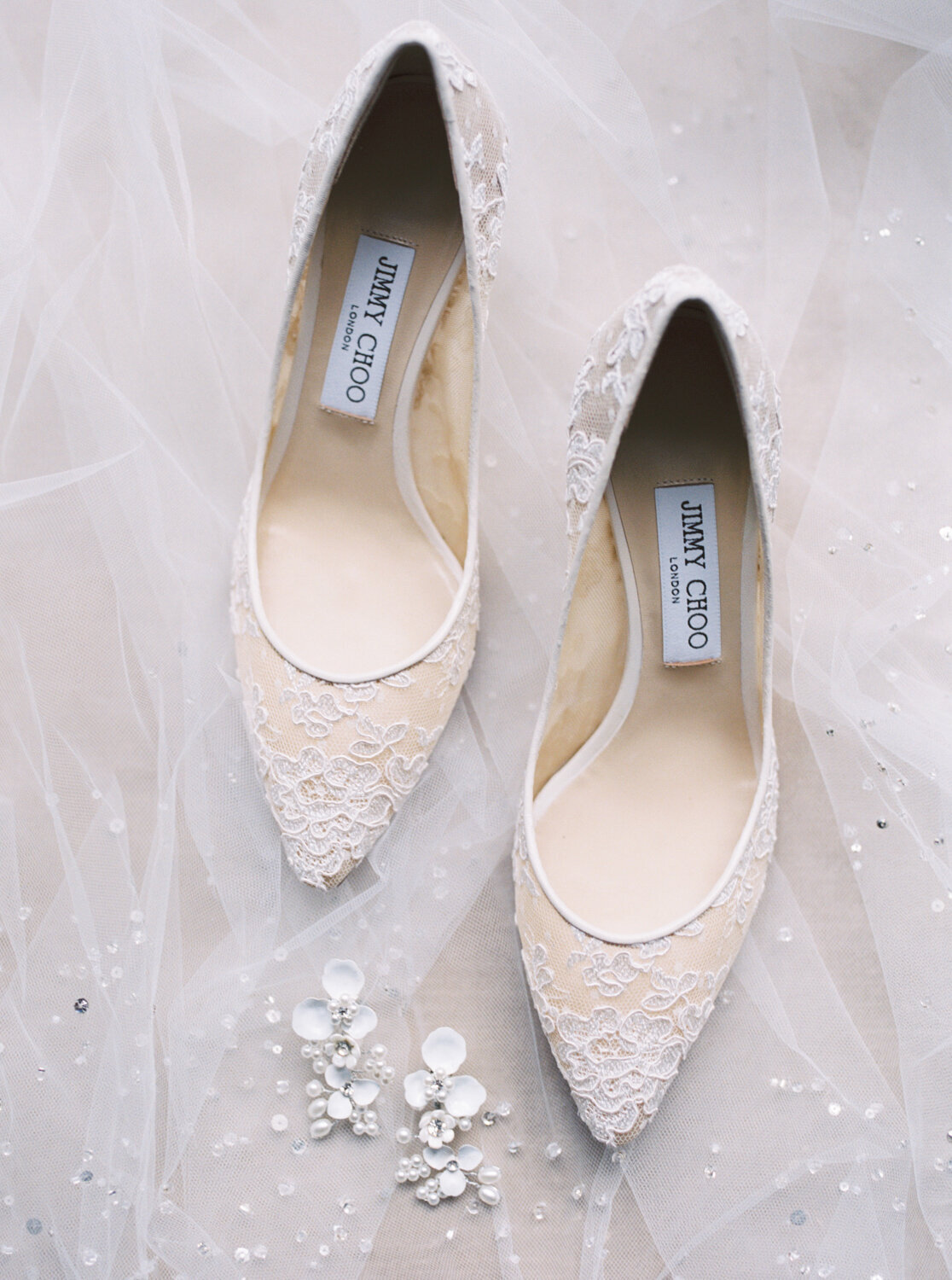 flat lay of bride's Jimmy Choo wedding shoes