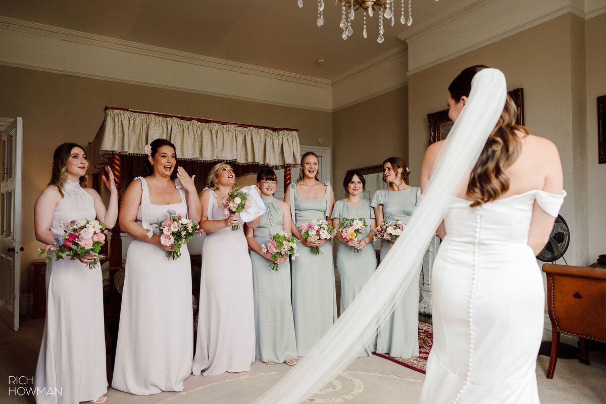 Bride with her bridesmaids first look