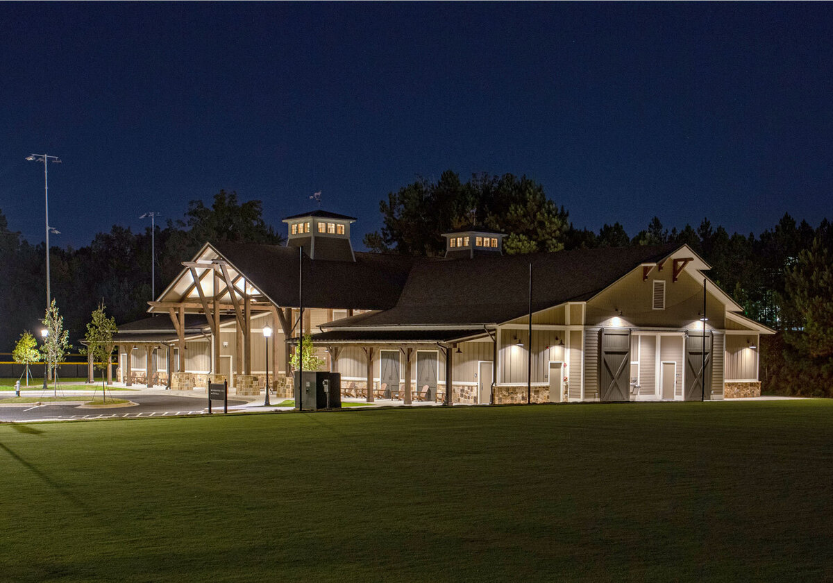 looking at the athletic field house at twilight at the Wesleyan School