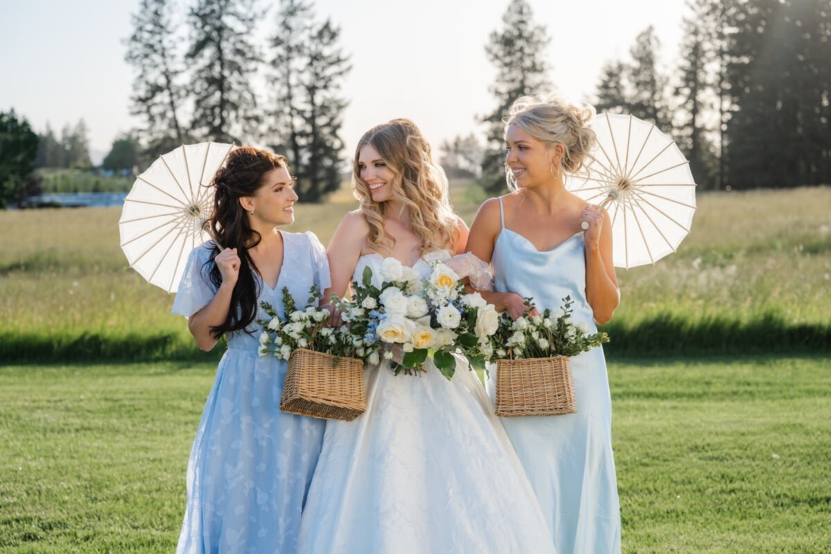 bridal party blue dresses and parasols spokane farm wedding
