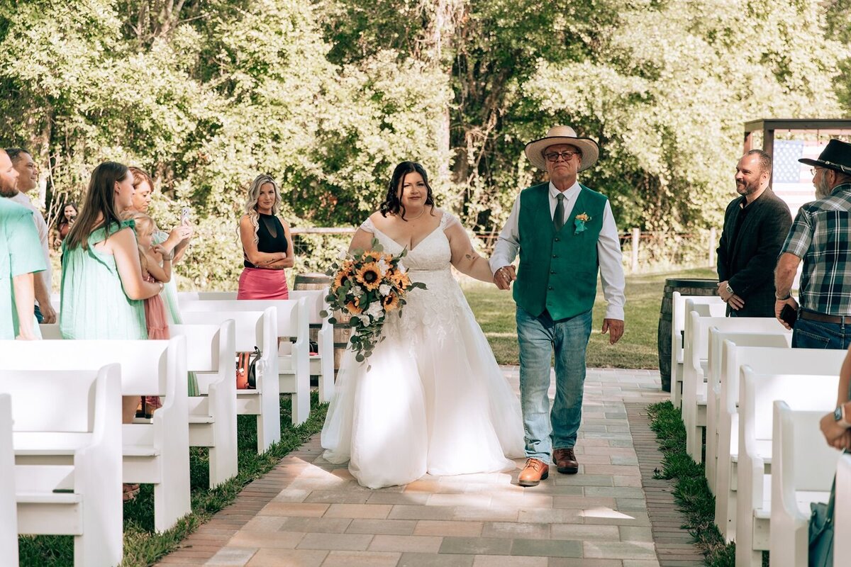 the farmhouse on 44 ceremony bride walks down the aisle