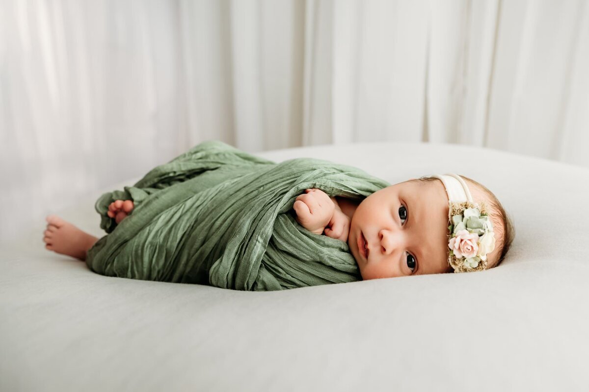 baby girl looking at camera during a studio photography session