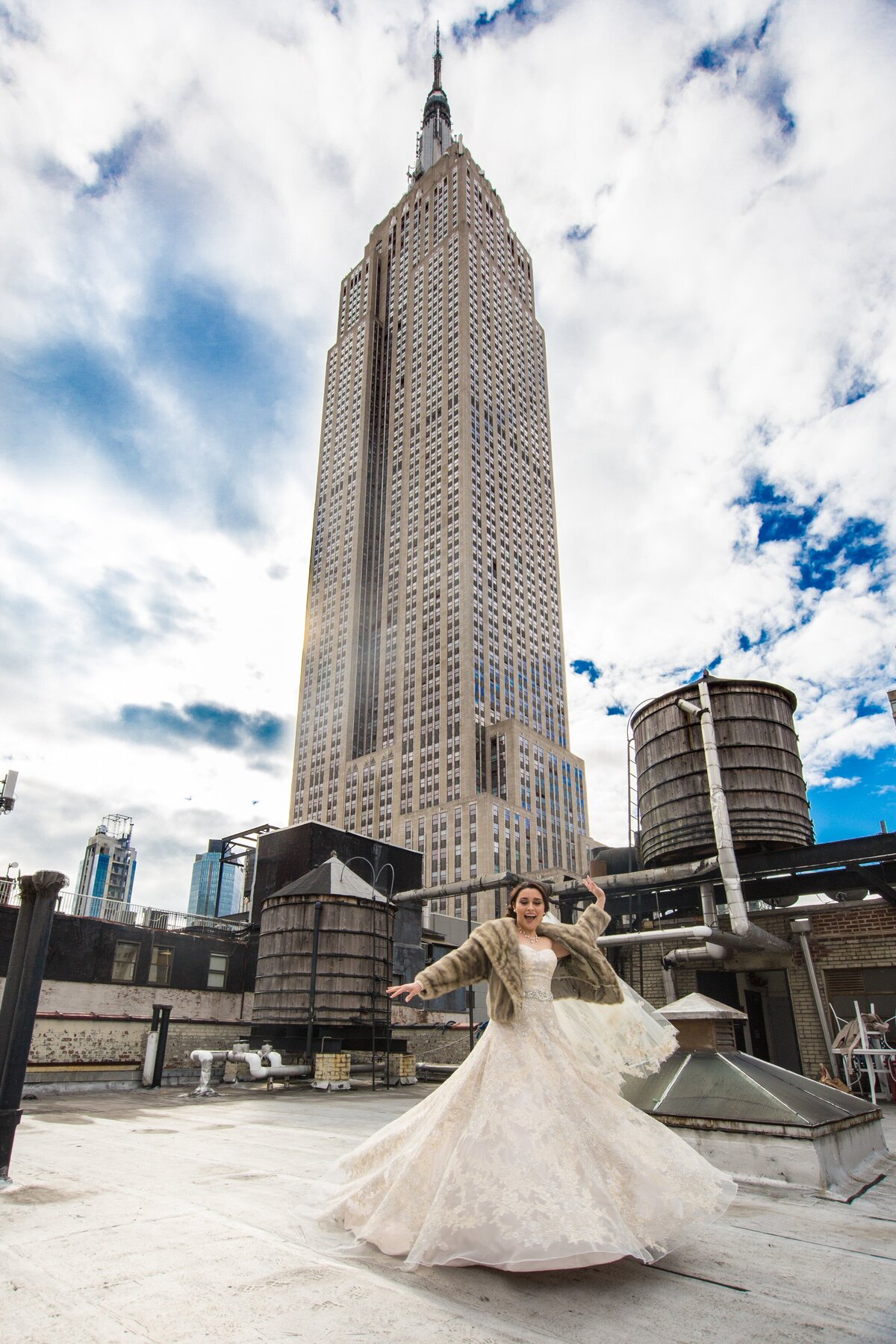 A bride dancing on a rooftop.