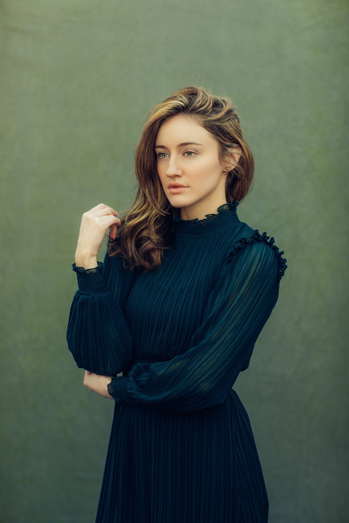 Portrait Photo Of Young Woman In Black Dress Looking Straight Ahead Los Angeles