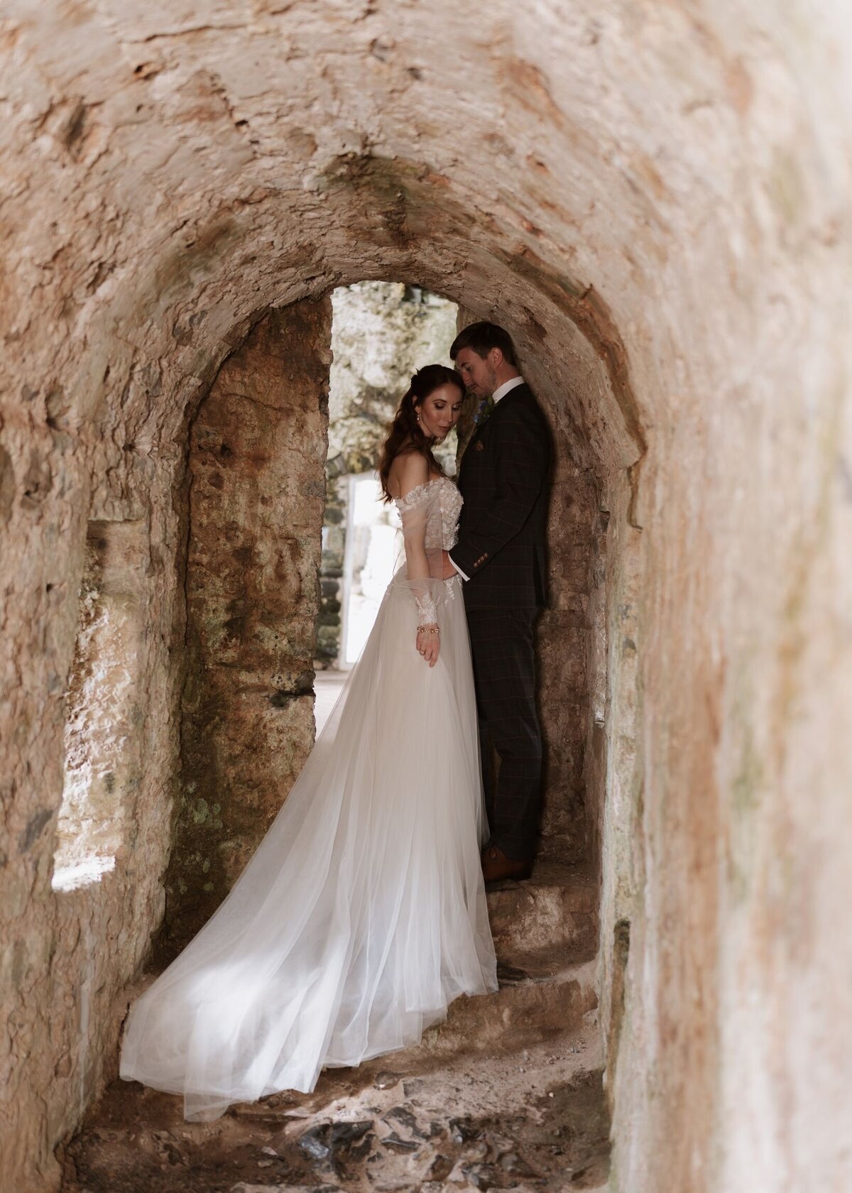Bride and groom have their couple portraits in the castle