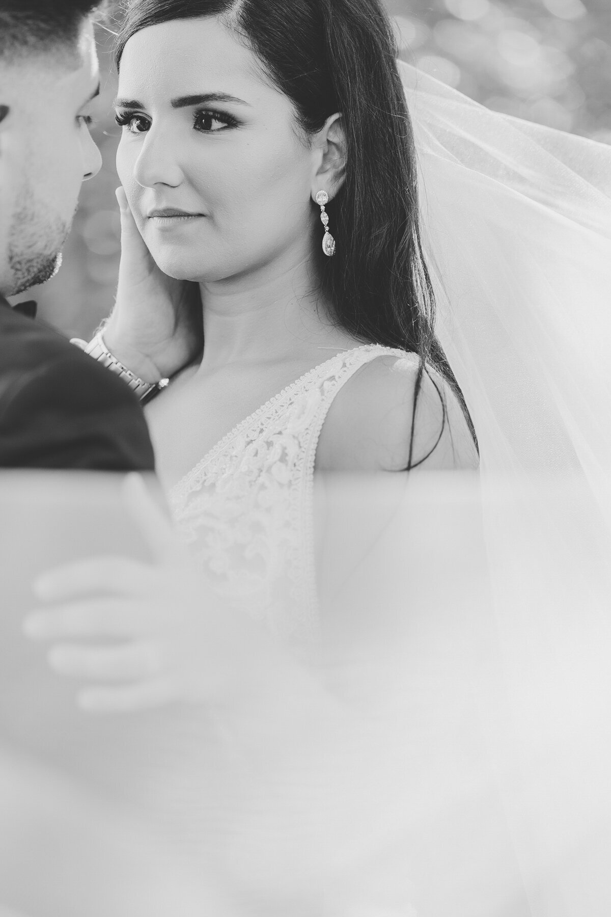 A bride looking deep into her grooms eyes