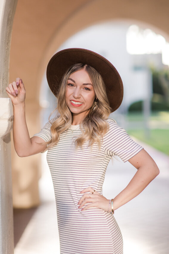 San Diego State senior leaning against wall