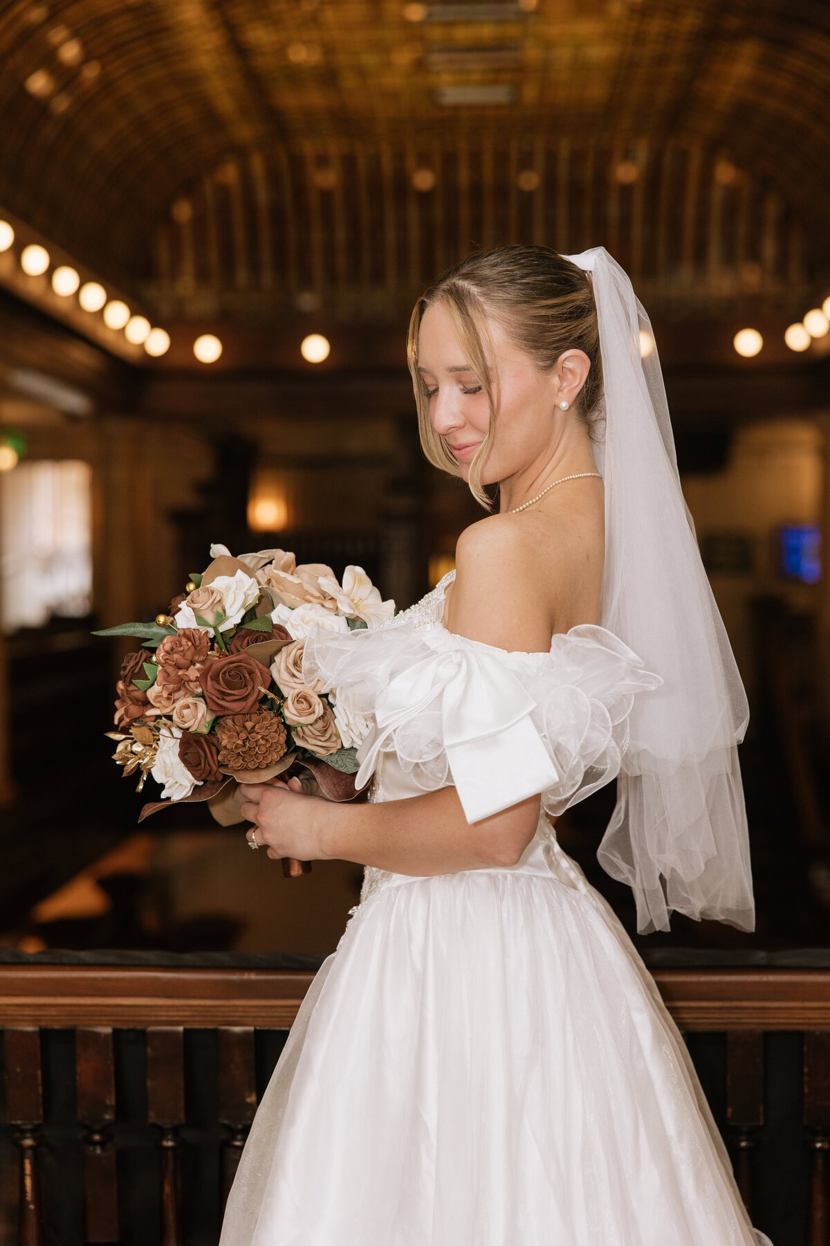 A bride poses for a photo at Hotel Boulderado in Boulder, Colorado.