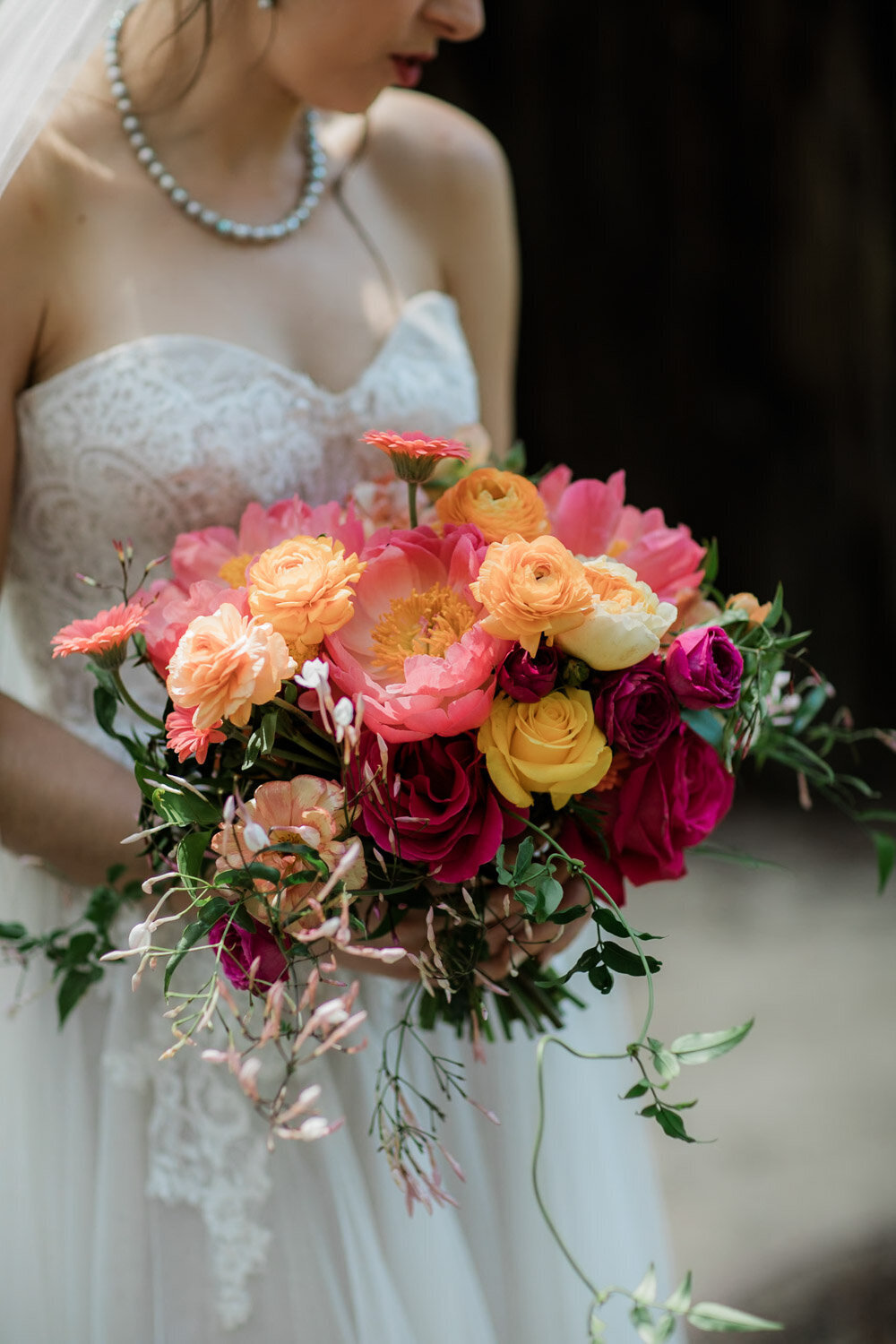 Bride holding her bouquets with full of colors