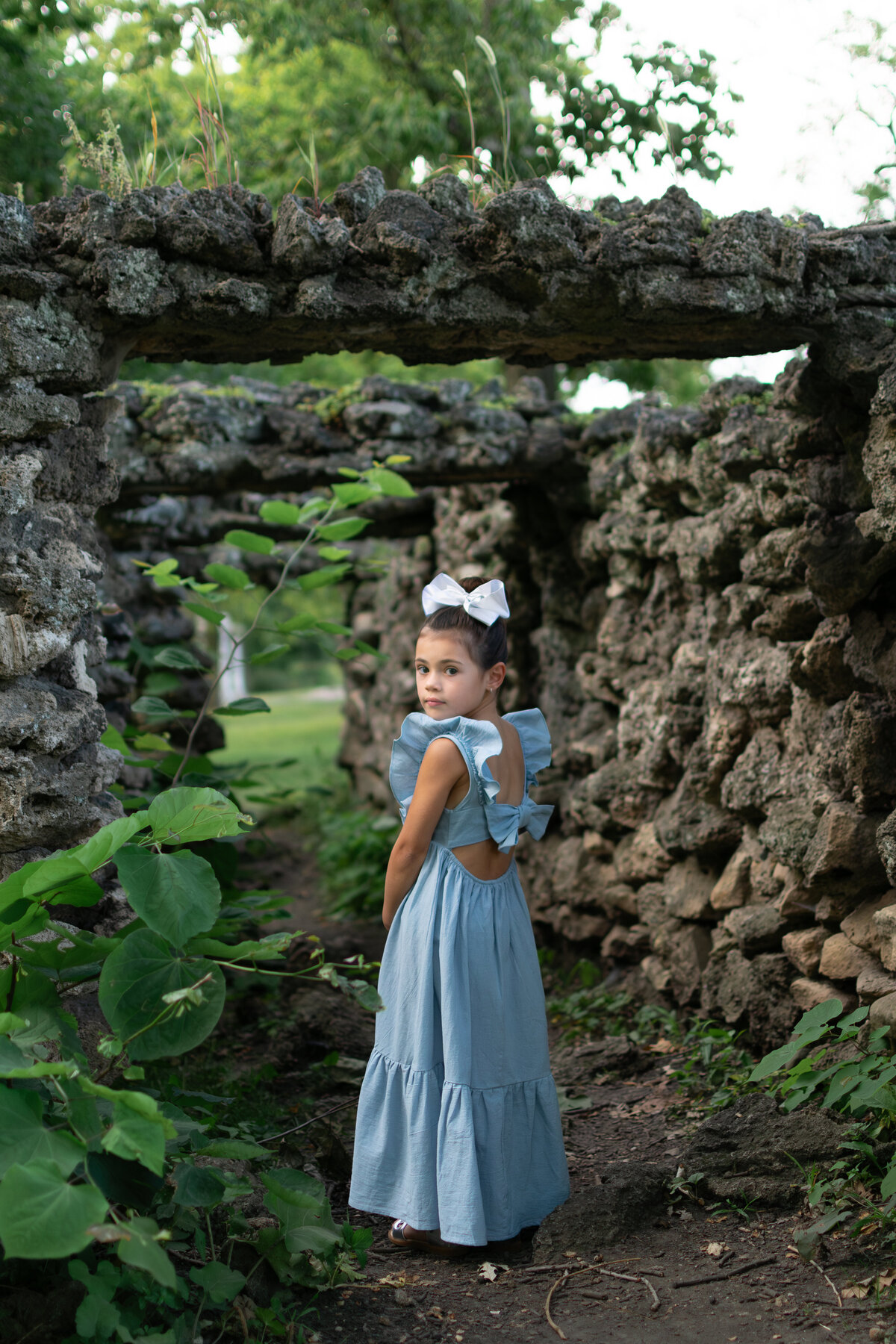Sweet five year old girl surrounded by nature of the Fabyan Forest Preserve in Batavia, IL