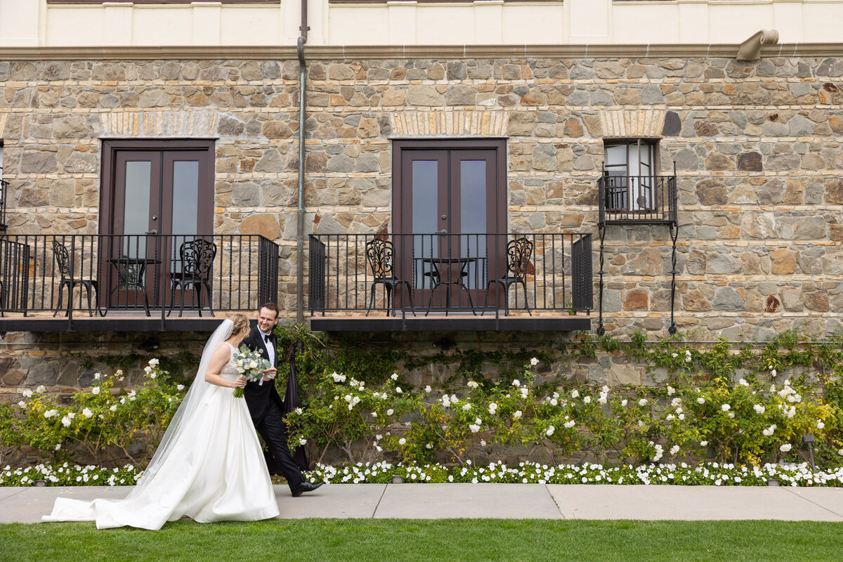 Couple walking on the lawn overlooking the Pacific Ocean